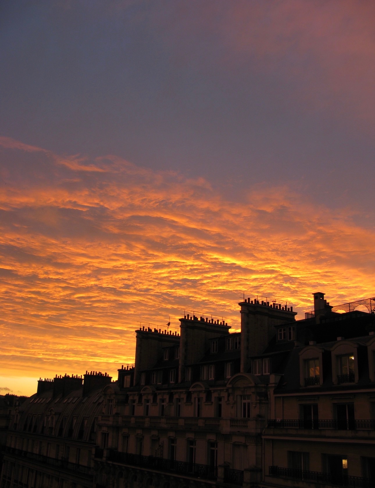 Paris rooftops at sunset